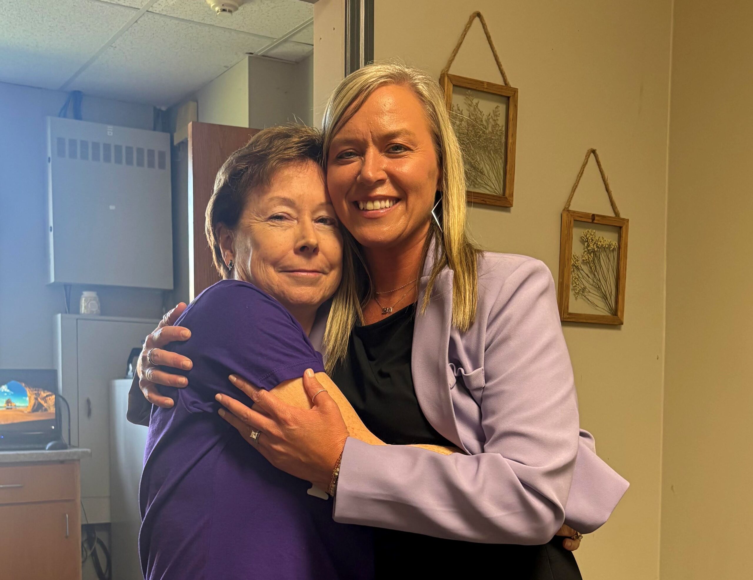 Kelly Sullivan-Connatser gives Toni Gioioso a farewell hug during her final week at The King's Academy
