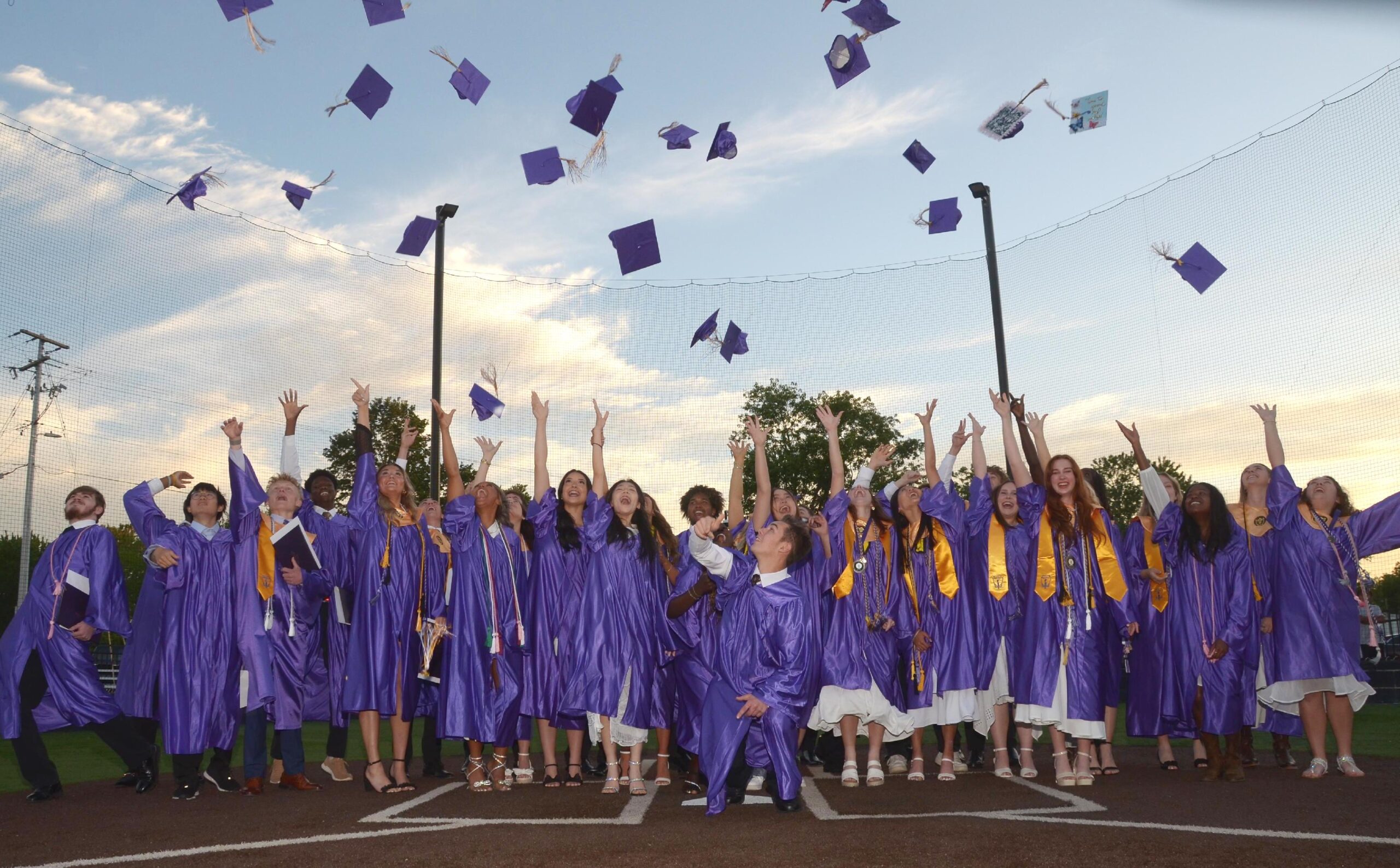 The King's Academy Class of 2026 celebrates graduation with a cap toss