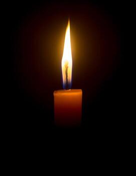 A candle burning in remembrance