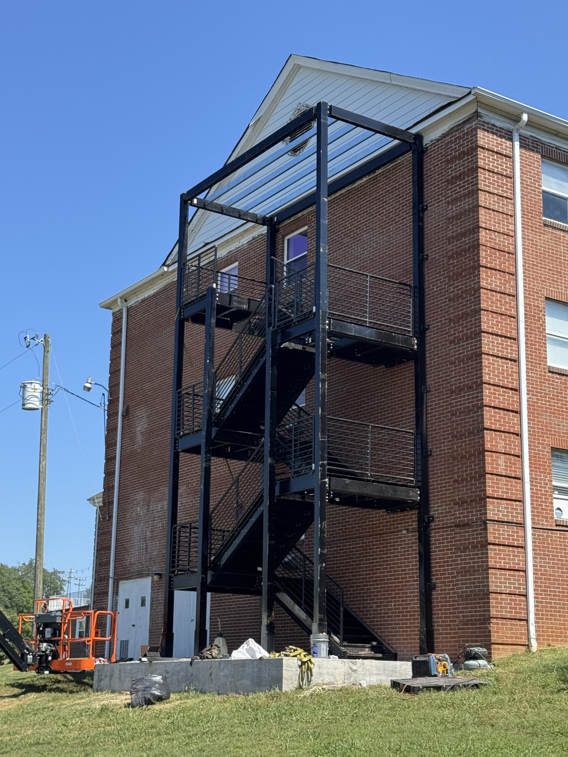 New exterior fire escape being installed on the back of Schubert Dorm at The King's Academy